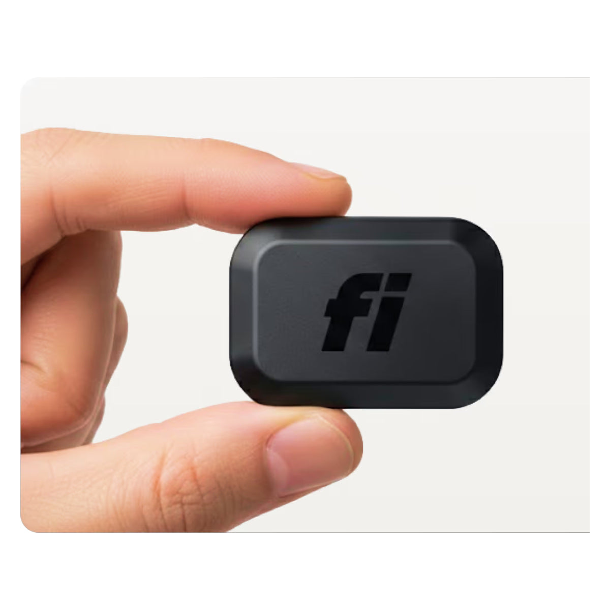Fi Mini GPS tracker module held between fingers on a clean white background