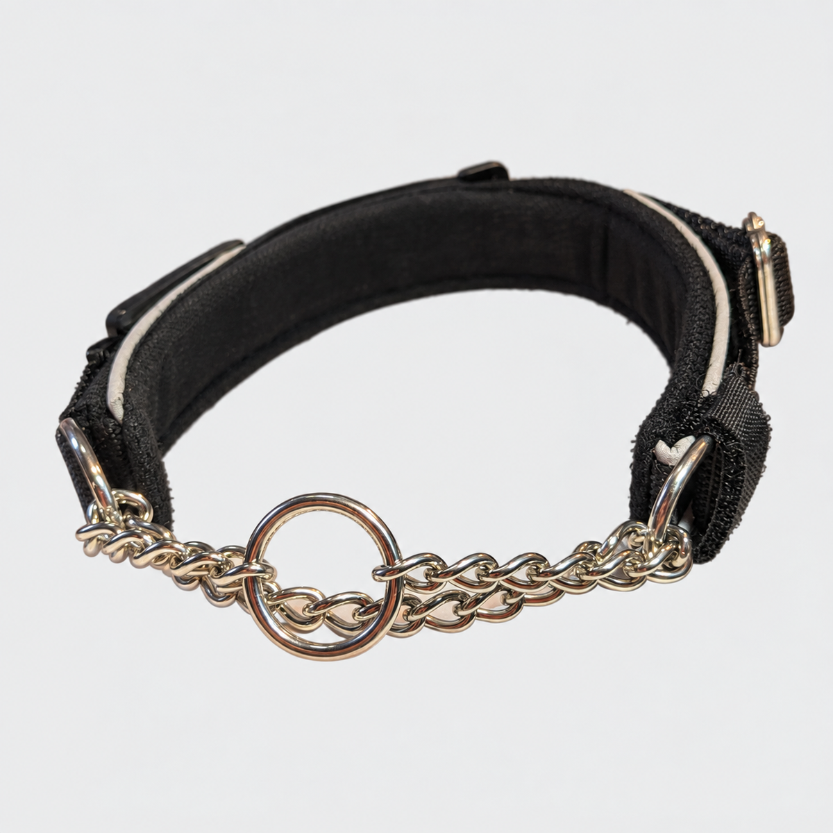 Stainless steel martingale chain option shown installed on a charcoal padded collar; collar shown for context.