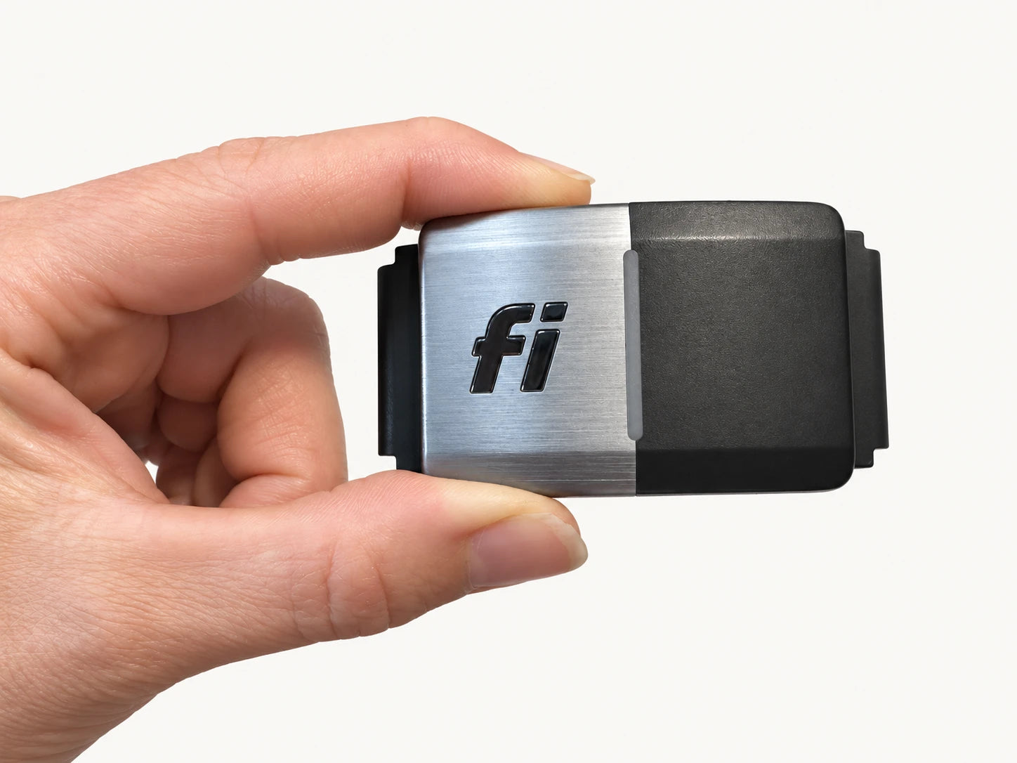 Fi Series 2 tracker held between fingers